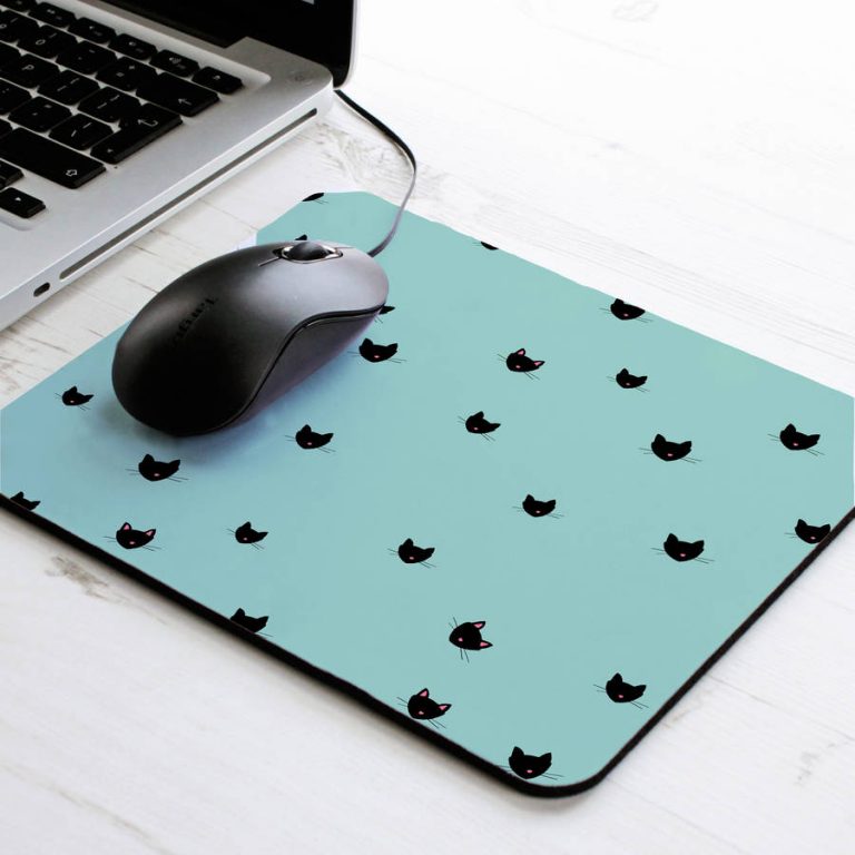 mouse pad with mouse on a desk